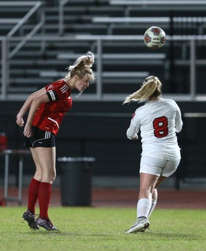 Bay's Sarah Detzel (15) heads the ball past Bozeman's Stephanie Field during a game Jan. 27, 2020 at Tommy Oliver Stadium. [PATTI BLAKE/THE NEWS HERALD]