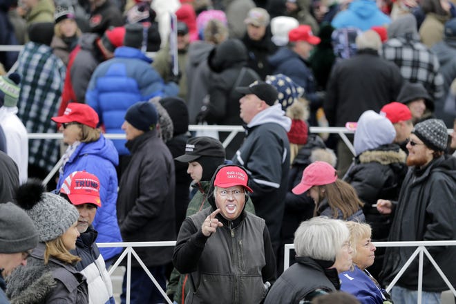 People stand in line to get into a campaign rally with President Donald Trump in Wildwood, N.J., Tuesday, Jan. 28, 2020. (AP Photo/Seth Wenig)
