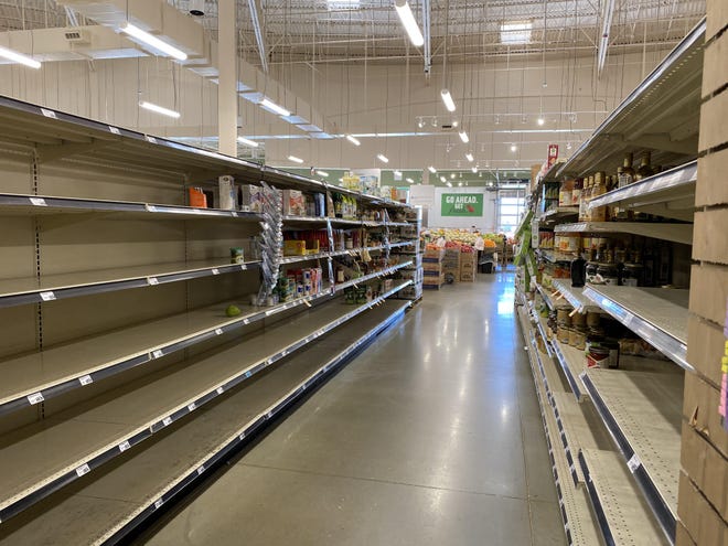 Many of the shelves at the Lucky’s Market in Clermont are empty in anticipation of its closing next month. [Roxanne Brown/Daily Commercial]
