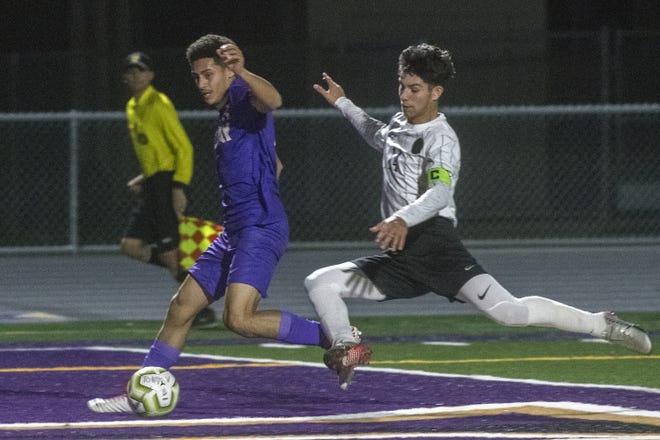 Tokay's Jose Contreras, left, gets past Tracy's Jose Avalos to score a goal on Wednesday at Tokay High School in Lodi.[CLIFFORD OTO/THE RECORD]