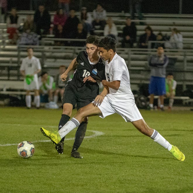 Paxon's Arya Sharifai, right, tries to win possession from Ponte Vedra midfielder Nico Gosendi during the second half of a 2019 Region 1-3A quarterfinal. Gosendi scored the opening goal in Ponte Vedra's 4-0 win. [WILL BROWN/THE RECORD]
