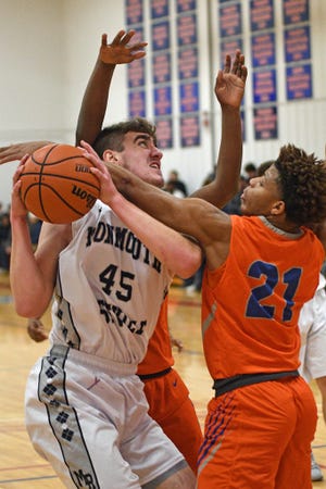 Monmouth-Roseville sophomore Ben Anderson battles for a shot against Quest's Tre Ashby during the Sandburg Shootout on Saturday, Jan. 4 at John M. Lewis Gymnasium. [BILL NICE/The Register-Mail]