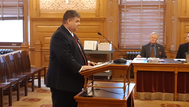Rep. Michael Capps, R-Wichita, spoke on behalf of a dozen other House Republicans on Thursday to request support from the House Federal and State Affairs Committee for a bill requiring all public buildings in Kansas accept donated displays of "In God We Trust" and the Kansas and U.S. flags. [Tim Carpenter/The Capital-Journal]