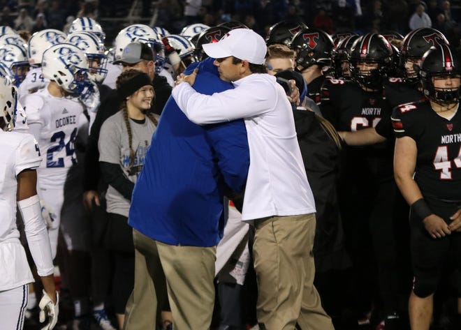 Oconee County head coach Travis Noland and North Oconee head coach Tyler Aurandt before the game on November 1, 2019 (Photo by Matthew Caldwell/Athens Banner-Herald/mcaldwell@onlineathens.com)