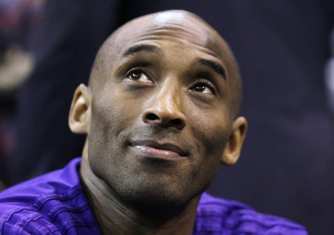 FILE - In this March 28, 2016 file photo, Los Angeles Lakers forward Kobe Bryant looks on before the start of their NBA basketball game against the Utah Jazz in Salt Lake City. Bryant announced an animated short film, "Dear Basketball," that will be composed by John Williams, directed by Glen Keane and narrated by Bryant. (AP Photo/Rick Bowmer, File)