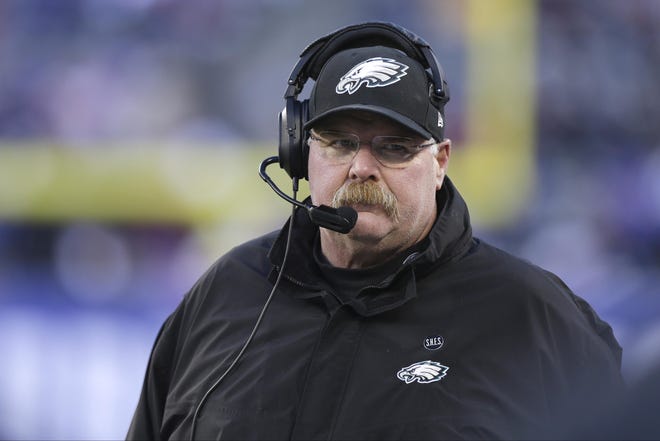Andy Reid walks the sidelines during his final game as Eagles coach on Dec. 30, 2012. (AP Photo/Kathy Willens)