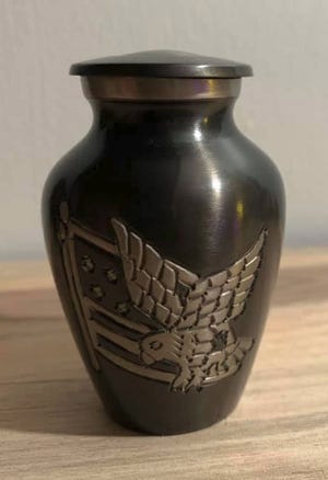 This urn, with ashes inside, was recently bought at a Goodwill in Peoria. The buyer wants to return it to the proper family. [PHOTO PROVIDED]