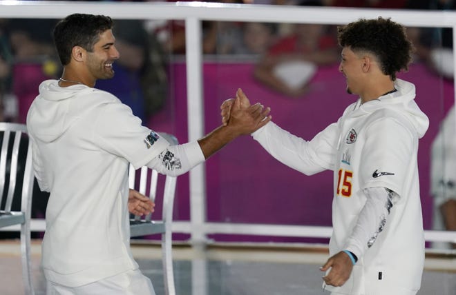 Kansas City Chiefs quarterback Patrick Mahomes (right) greets San Francisco 49ers' Jimmy Garoppolo on Monday at Marlins Park in Miami. The two square off in the Super Bowl on Sunday. [AP File Photo/Morry Gash]