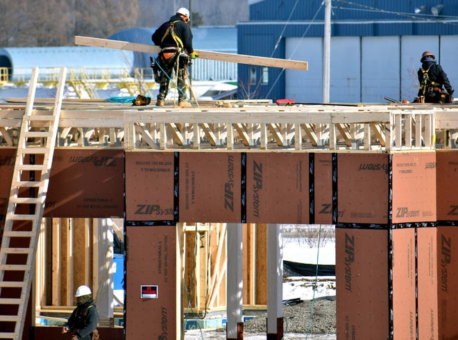 Work continues Thursday at Air City Lofts at Griffiss Business and Technology Park in Rome. [EDWARD HARRIS / OBSERVER-DISPATCH]