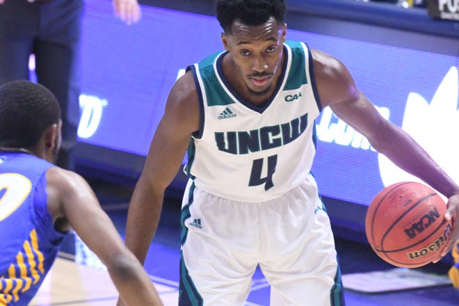 UNCW's Mike Okauru drives inside against Hofstra at Trask Coliseum on Jan. 16. Okauru led the Seahawks in a loss to James Madison with 22 points. [KEN BLEVINS/STARNEWS]
