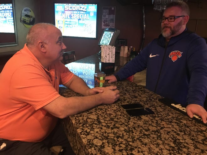 Colchester resident Vito Capaso and Bartender Carson Bagley chat at Scorezz Sports Bar and Grill at the Holiday Inn Norwich. [MATT GRAHN/NORWICHBULLETIN.COM]