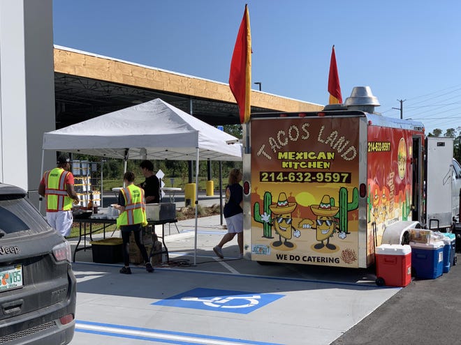 A food truck serves employees at the new Amazon "last-mile" delivery station that opened on Mason Avenue in Daytona Beach on Wednesday, Sept. 25, 2019. The retail giant collects and remits sales tax to Florida and other states. [News-Journal/Clayton Park]