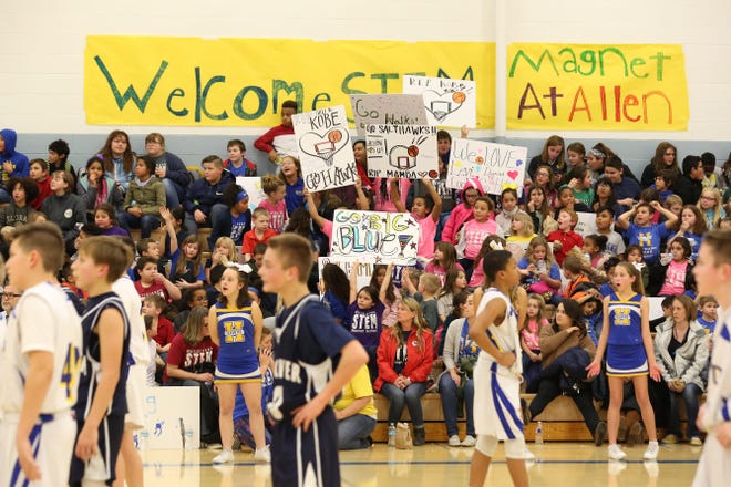 More than 150 K-6 students and their teachers from Magnet School at Allen attended the HMS-7 boys basketball game Thursday after school during an event called Hawk It Out. [Sandra J. Milburn/HutchNews]