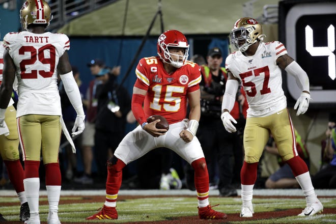 Kansas City Chiefs quarterback Patrick Mahomes (15) celebrates after scoring against the San Francisco 49ers during the first half of the NFL Super Bowl 54 football game Sunday, Feb. 2, 2020, in Miami Gardens, Fla. (AP Photo/Patrick Semansky)