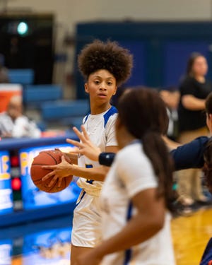 Pflugerville freshman Avari Berry looks for an opening in the 59-49 win over Glenn last week. [HENRY HUEY/FOR STATESMAN]