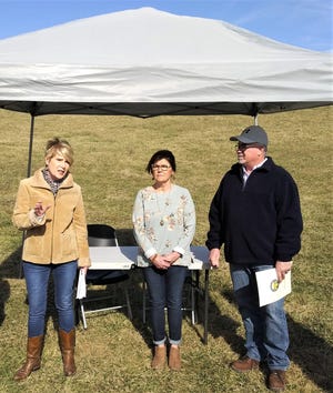 Ohio Department of Agriculture Director Dorothy Pelanda adresses Ginny and Doug Anderson and the group assembled for the signing of the 500th easement through the Farmland Preservation Program on Monday afternoon at Anderson's farm on County Road 51 in Big Prairie.