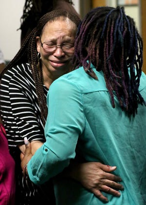Keytiada Tyshica Montay Cooke's mother, Arnetta Cooke, and her daughter, Satoya Cooke, embrace outside the courtroom at the Gaston County Courthouse Monday afternoon after bail was increased for Katelyn Abernathy, the suspected impaired driver that struck and killed Keytiada and Charles Henry Love early Sunday morning on East Long Avenue near the Arthurs & Foltz Law Office as the two were walking down the sidewalk. Abernathy is charged with two counts of felony death by vehicle and is being held on a $1 million bond in the Gaston County Jail. [JOHN CLARK/THE GASTON GAZETTE]