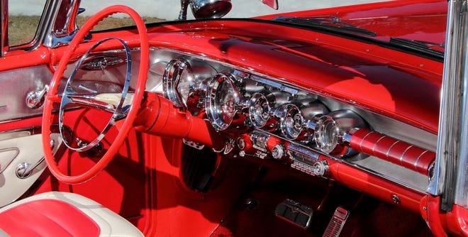 Reader Ralph Herrold points to the beauty of the 1958 Pontiac and its “jukebox” interior dashboard that is loaded with chrome bezels and many buttons. Shown here is a Pontiac Bonneville convertible interior. [General Motors]