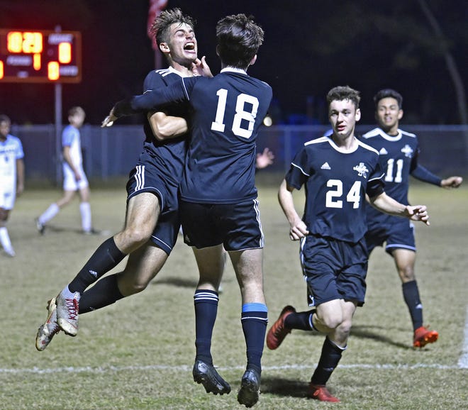 Sarasota Sailors' La Rosa Francesco (10), far left, celebrates scoring the first point of the game. The Sailors won 2-0 over the North Port Bobcats Tuesday night, February 4, 2020, in Sarasota during the Class 6A-District 7 tournament. [HERALD-TRIBUNE STAFF PHOTO / THOMAS BENDER]