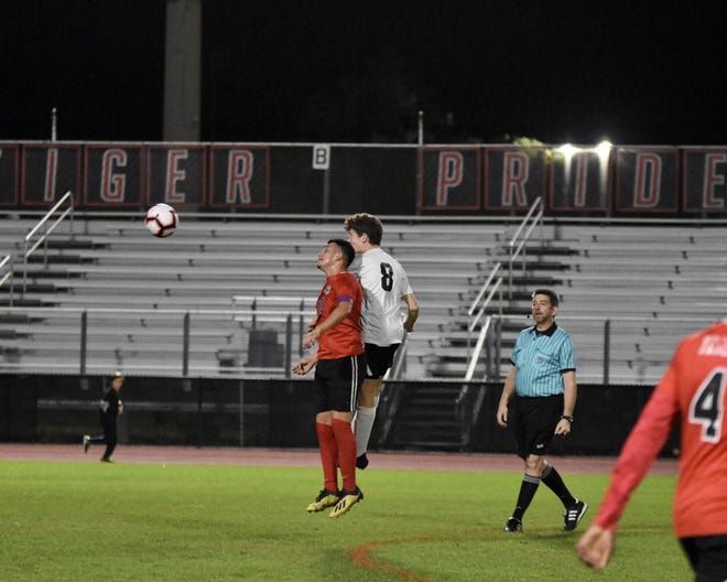 Attacking midfielder Danny Paniagua (red jersey) is the Tigers leading scored this season. [Courtesy photo]