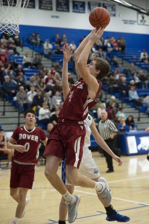 Dover’s Kade Ruegsegger goes to the hoop for two. (Cambridge Daily Jeffersonian / Lewis Perkins)