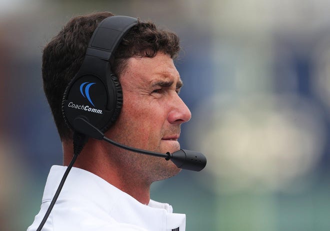 Akron coach Tom Arth watches the action on the field during the first quarter of a game in September at InfoCision Stadium. [Jeff Lange/Beacon Journal]