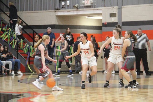 Shelby Bute, No. 14, and Shelby Laird, No. 24, are shown defending against Barnsdall in a game earlier this season, which the Lady Huskies won, 60-44. Journal-Capital photo