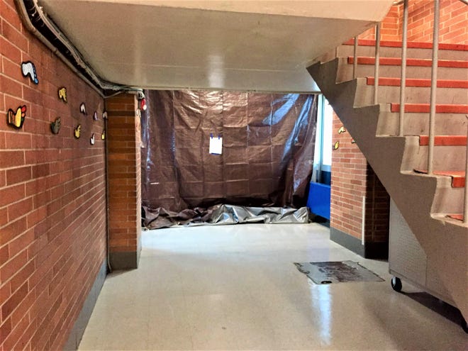 The library at Poquessing Middle School in Lower Southampton was sealed off Tuesday after district workers found flaking paint containing asbestos on a small portion of the ceiling. [CONTRIBUTED]