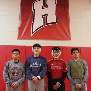 From left to right: John Gordon, Isaiah Bernal, Jorge Rojas and Emanuel Sanchez pose for a photo on Feb. 4 in Holland. [Beau Troutman/Sentinel Staff]