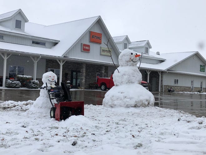 These two snowmen have taken up residence in front of Schlabach Engine on South Carr Road near Apple Creek.