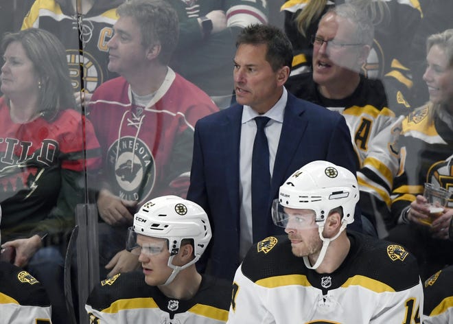 Boston Bruins coach Bruce Cassidy watches play against the Minnesota Wild from the bench Feb. 1. (AP File Photo/Hannah Foslien)