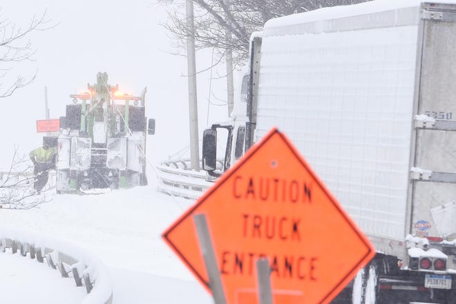 A large tow truck attempts to pull out a stuck tractor trailer on the North Genesee Street ramp on Friday, Feb. 7, 2020 in Utica. Oneida County Executive Anthony J. Picente Jr. has issued a travel advisory effective immediately due to inclement winter weather conditions. [ALEX COOPER / OBSERVER-DISPATCH]