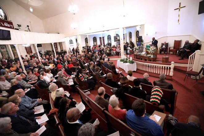 Hundreds fill the sanctuary at Mount Pleasant First United Methodist Church for a Memorial Service for the Victims of Lynching in Alachua County in Gainesville on Thursday. Alachua County has begun the process for truth and reconciliation, to recall the county's history of racial injustice. The event was to honor the more than 40 victims of extrajudicial violence in the county from 1867 to 1929. [Brad McClenny/Staff photographer]
