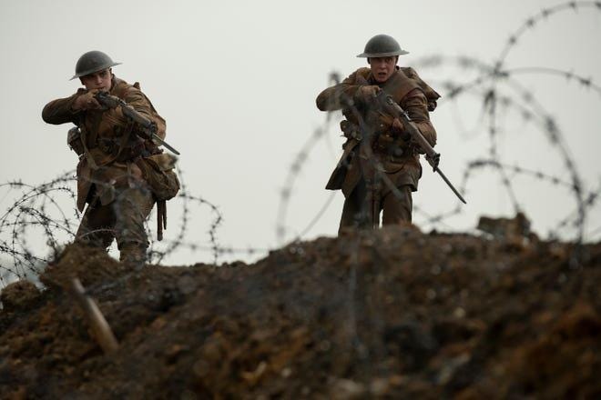 Blake (Dean-Charles Chapman), left, and Schofield (George MacKay) make their way through no man's land in "1917." [Francois Duhamel/Universal Pictures and Dreamworks Pictures]