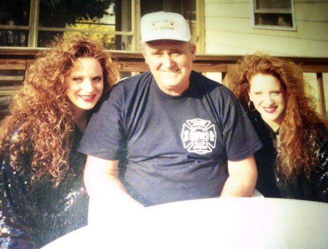 A past family photo of MaryAnn Coulter and Diane Carey-Stranko with their father, former fire chief and councilman Clark T. Carey. [CONTRIBUTED]