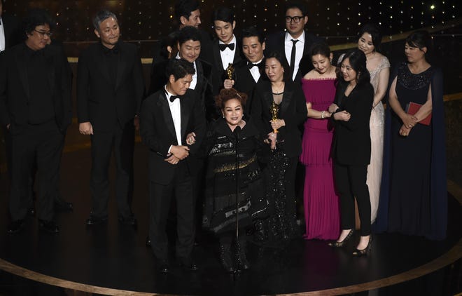 The cast and crew of "Parasite" accept the award for best picture at the Oscars on Sunday, Feb. 9, 2020, at the Dolby Theatre in Los Angeles. (AP Photo/Chris Pizzello)