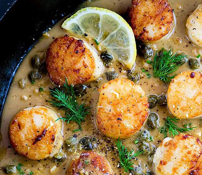 Scallops benefit from a hot pan and the late addition of butter. To that, you can add ingredients including capers, parsley, lemon juice and garlic. [Contributed]
