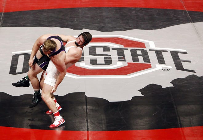 Gary Traub of Ohio State is in control against Jack Heyob of Northwestern in the heavyweight division during the teams’ Big Tem wrestling match Sunday at the Covelli Center. Traub won 13-3. [Eric Albrecht/Dispatch]