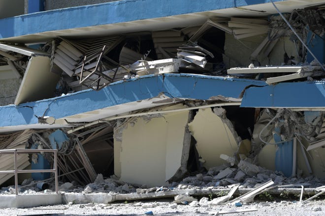 The Adripina Seda public school stands partially collapsed after an earthquake struck Guanica, Puerto Rico, on Jan. 7. Schools closed on the island after thet series of quakes and tremors. [Carlos Giusti/Associated Press]