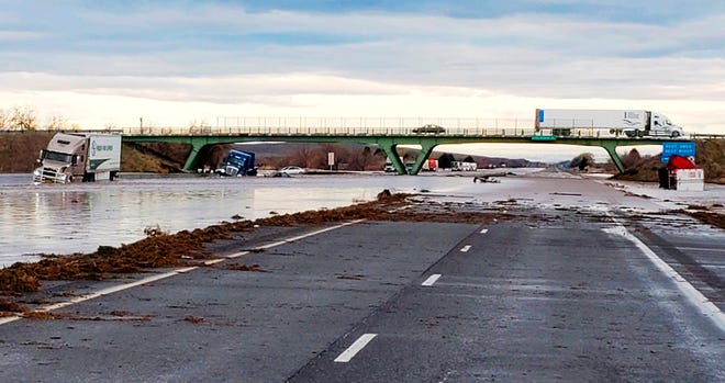 This photo provided by the Oregon State Police shows severe flooding on Interstate 84, a major freeway linking Idaho and Oregon, near Hermiston, Ore., Friday, Feb. 7, 2020. Flooding has forced evacuations in low-lying areas and stranded at least one family on their roof. Snow melt caused the Umatilla River and other tributaries in northeast Oregon to overflow their banks late Thursday. (Oregon State Police via AP)