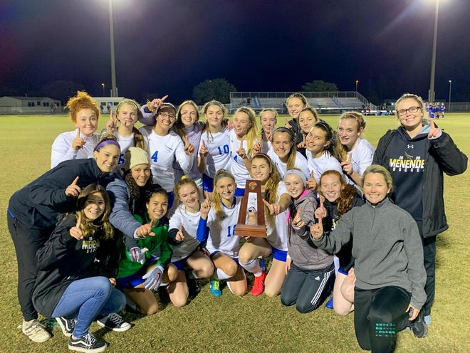 Menendez's girls soccer team won its first district title in school history on Friday night after beating Clay 2-1 in extra time. Morgan Schooley scored both goals to lift the Falcons. [Contributed]