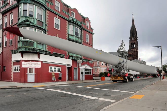 A wind turbine blade that arrived at the New Bedford Marine Commerce Terminal in September travelling down Acushnet Avenue on its way to the town of Russell for a land-based wind farm. [PETER PEREIRA/THE STANDARD-TIMES/SCMG]