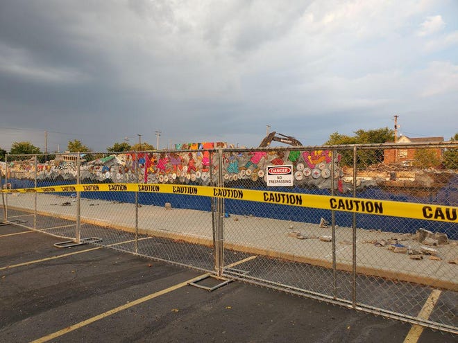 A mural based on an Aminah Robinson work painted on the side of a State Auto Insurance Company warehouse was torn down in September. [Scott Woods/Alive]