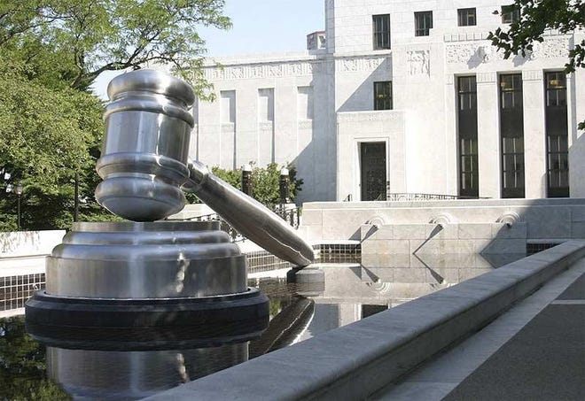 A 30-foot stainless steel gavel sits in the south reflecting pool of the Ohio Judicial Center, home of the Ohio Supreme Court. [Photo courtesy Ohio Supreme Court]