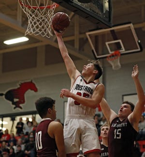Shallowater's Kieran Elliott (35) puts up a shot during the ninth-ranked Mustangs’ 57-47 victory Tuesday against No. 10 Abernathy. Shallowater clinched the District 2-3A title. [Brad Tollefson/A-J Media]