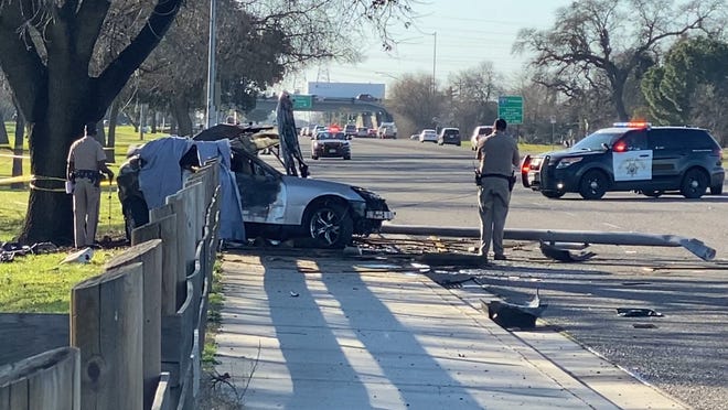 Authorities investigate at the scene of a fatal crash on Eight Mile Road in north Stockton on Tuesday afternoon. [CASSIE DICKMAN/THE RECORD]