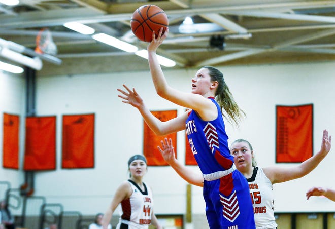 West Holmes' Katrina Rolince (23) puts up a shot during a high school girls basketball game against Ashland on Wednesday at Arrow Arena. The Knights won, 59-23.