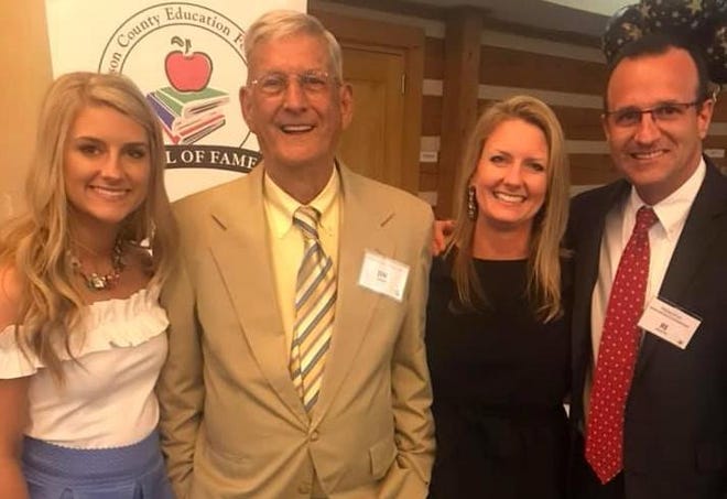 Jim “Papa” Laughter poses with this family at last year's Henderson County Education Foundation's Hall of Fame ceremony. From left are his granddaughter Emma, his daughter-in-law Amy and his son BJ. [PHOTO PROVIDED]