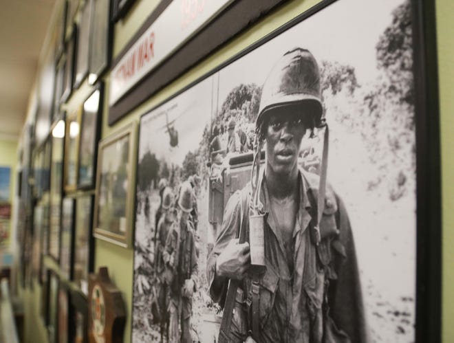 A photo of an African-American soldier with the 173rd, 2-503 Sky Soldiers during the Vietnam War hangs on a wall inside G.I. Joe's Military Living History Museum, located at 1165 B NC-11 in Kinston. [Brandon Davis/Kinston Free Press]