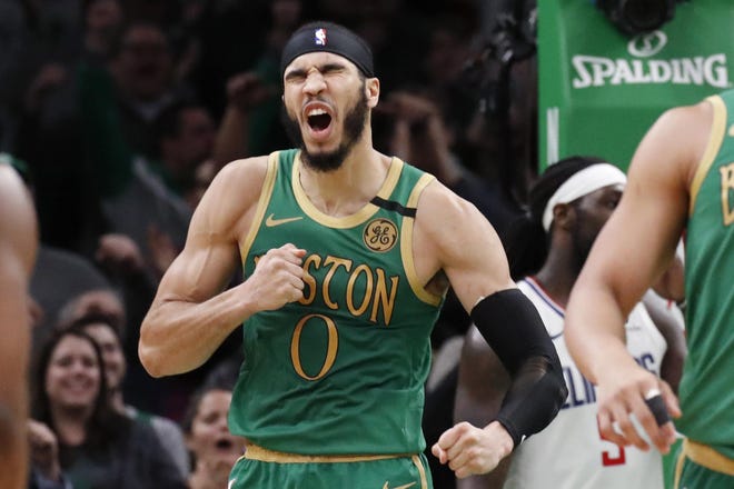 Jayson Tatum celebrates after a basket in the second overtime of Thursday’s game against the Los Angeles Clippers in Boston. Tatum scored 39 in the Celtics’ victory. [AP / Elise Amendola]